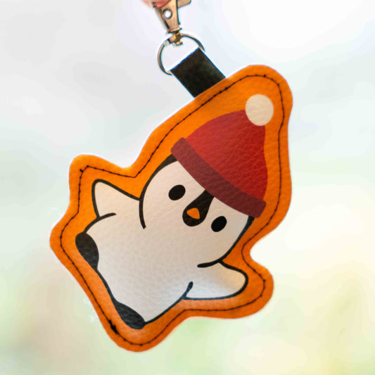 Taschengebömsel Pinguin Mütze